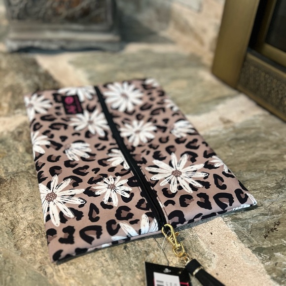 Makeup Junkie Handbags - Makeup Junkie bag size large. Daisy cheetah print. Hard to find; new with tags.